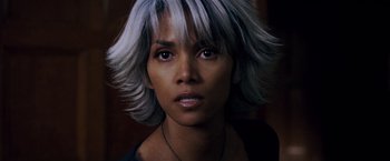 Movie still from “X-Men: The Last Stand” (2006), directed by Brett Ratner – A person wearing a necklace; Close Up shot, High angle