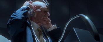 Movie still from “X2” (2003), directed by Bryan Singer – An old man with a lot of wires around his head; Close Up shot, Low angle