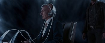 Movie still from “X2” (2003), directed by Bryan Singer – An old man wearing headphones and sitting in a chair; Close Up shot, Low angle