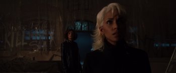 Movie still from “X2” (2003), directed by Bryan Singer – Two women standing next to each other in front of a window; Close Up shot, Low angle