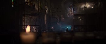 Movie still from “X2” (2003), directed by Bryan Singer – A person standing in a room with a light on; Extreme Wide shot, Low angle