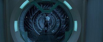 Movie still from “X2” (2003), directed by Bryan Singer – A man walking down a hallway in a tunnel; Wide shot, High angle
