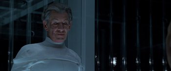 Movie still from “X2” (2003), directed by Bryan Singer – An older man in a white suit standing in front of a window; Close Up shot, Low angle