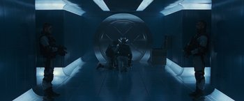 Movie still from “X2” (2003), directed by Bryan Singer – A group of people sitting in a room; Wide shot, Overhead angle