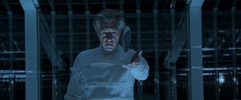 Movie still from “X2” (2003), directed by Bryan Singer – An older man in a white suit holding a mirror; Close Up shot, Low angle