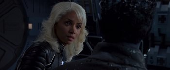 Movie still from “X2” (2003), directed by Bryan Singer – A person with long white hair; Close Up shot, Over the shoulder angle
