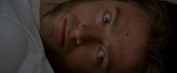 Movie still from “X2” (2003), directed by Bryan Singer – A man's eyes and forehead; Extreme Close Up shot, Overhead angle