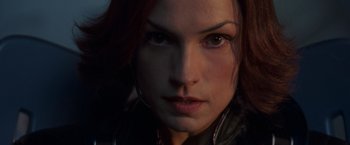 Movie still from “X2” (2003), directed by Bryan Singer – A woman's face in a black jacket; Close Up shot, Low angle