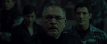 Movie still from “X2” (2003), directed by Bryan Singer – A person wearing glasses; Close Up shot, Over the shoulder angle