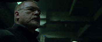 Movie still from “X2” (2003), directed by Bryan Singer – An older man wearing glasses looking into the distance; Close Up shot, Low angle