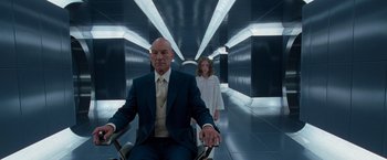 Movie still from “X2” (2003), directed by Bryan Singer – A man and a woman are walking down a hall way; Medium shot, Low angle