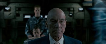 Movie still from “X2” (2003), directed by Bryan Singer – A man in a suit and a tie; Close Up shot, Low angle