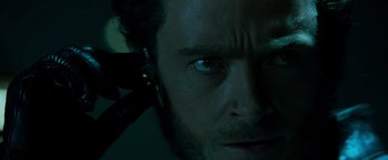 Movie still from “X2” (2003), directed by Bryan Singer – A man's face in the dark; Close Up shot, Low angle