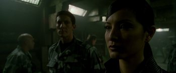 Movie still from “X2” (2003), directed by Bryan Singer – A man and a woman in military fatigues; Close Up shot, Over the shoulder angle