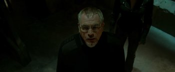 Movie still from “X2” (2003), directed by Bryan Singer – An older man wearing glasses looking at the camera; Close Up shot, Low angle