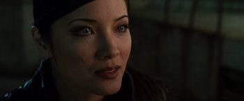 Movie still from “X2” (2003), directed by Bryan Singer – A woman's face in a dark room; Close Up shot, Over the shoulder angle