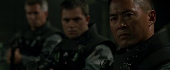 Movie still from “X2” (2003), directed by Bryan Singer – Two men in military uniforms are looking at the camera; Close Up shot, Over the shoulder angle