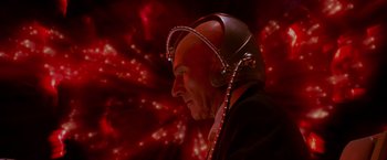 Movie still from “X2” (2003), directed by Bryan Singer – A man wearing a helmet and a suit is looking to the side; Close Up shot, Low angle