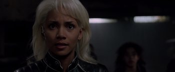 Movie still from “X2” (2003), directed by Bryan Singer – A woman with blonde hair wearing a leather jacket; Close Up shot, Over the shoulder angle
