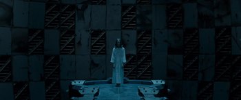 Movie still from “X2” (2003), directed by Bryan Singer – A person standing in front of a wall; Wide shot, Low angle