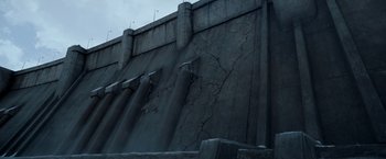 Movie still from “X2” (2003), directed by Bryan Singer – A concrete wall that has been damaged by water; Extreme Wide shot, Low angle