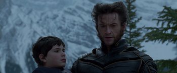 Movie still from “X2” (2003), directed by Bryan Singer – A man and a boy are standing next to each other; Close Up shot, Low angle