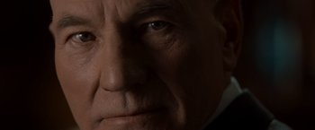 Movie still from “X2” (2003), directed by Bryan Singer – An old man with a bald head and a mustache; Extreme Close Up shot, Low angle