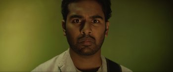 Movie still from “Yesterday” (2019), directed by Danny Boyle – A person wearing a shirt; Close Up shot, Low angle