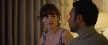 Movie still from “Yesterday” (2019), directed by Danny Boyle – A woman sitting next to a man in a room; Close Up shot, Over the shoulder angle