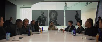 Movie still from “Yesterday” (2019), directed by Danny Boyle – A group of people sitting around a table; Medium shot, Over the shoulder angle