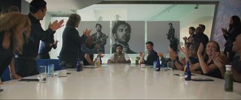 Movie still from “Yesterday” (2019), directed by Danny Boyle – A group of people sitting around a table; Wide shot, Over the shoulder angle