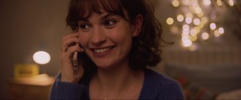 Movie still from “Yesterday” (2019), directed by Danny Boyle – A person talking on a cell phone; Close Up shot, Over the shoulder angle