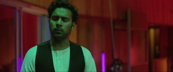 Movie still from “Yesterday” (2019), directed by Danny Boyle – A man in a white shirt and a black vest; Close Up shot, Low angle