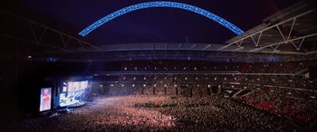 Movie still from “Yesterday” (2019), directed by Danny Boyle – A crowd of people in a stadium at a concert; Extreme Wide shot, High angle