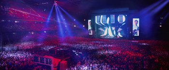 Movie still from “Yesterday” (2019), directed by Danny Boyle – A large crowd of people are in a stadium; Extreme Wide shot, High angle