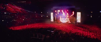 Movie still from “Yesterday” (2019), directed by Danny Boyle – A crowd of people in a stadium at a concert; Extreme Wide shot, High angle