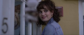 Movie still from “Yesterday” (2019), directed by Danny Boyle – A person wearing a jean jacket; Close Up shot, Over the shoulder angle