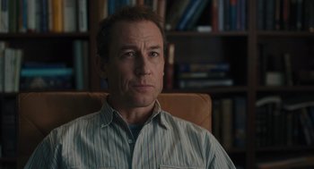 Movie still from “You Hurt My Feelings” (2023), directed by Nicole Holofcener – A person sitting in a chair in a room; Close Up shot, Over the shoulder angle