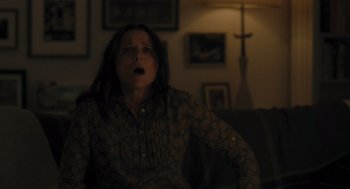 Movie still from “You Hurt My Feelings” (2023), directed by Nicole Holofcener – A woman sitting on a couch with her mouth wide open; Medium shot, Low angle