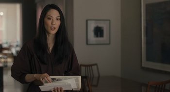 Movie still from “You Hurt My Feelings” (2023), directed by Nicole Holofcener – A woman holding a book in her hands; Medium shot, Over the shoulder angle