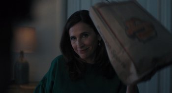Movie still from “You Hurt My Feelings” (2023), directed by Nicole Holofcener – A person smiling at the camera; Close Up shot, Over the shoulder angle