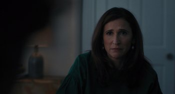 Movie still from “You Hurt My Feelings” (2023), directed by Nicole Holofcener – A person wearing a green shirt; Close Up shot, Over the shoulder angle