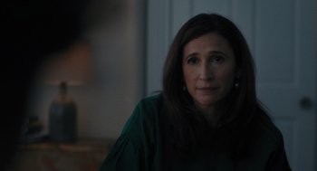 Movie still from “You Hurt My Feelings” (2023), directed by Nicole Holofcener – A person wearing a green shirt; Close Up shot, Over the shoulder angle