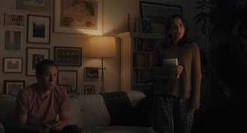 Movie still from “You Hurt My Feelings” (2023), directed by Nicole Holofcener – Two people standing in a living room in a room; Medium shot, Over the shoulder angle