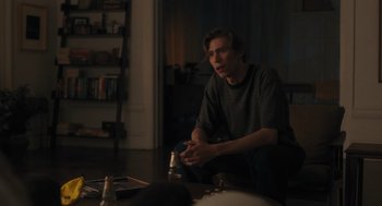 Movie still from “You Hurt My Feelings” (2023), directed by Nicole Holofcener – A man sitting on the floor in a living room; Medium shot, Over the shoulder angle
