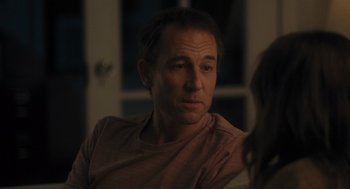 Movie still from “You Hurt My Feelings” (2023), directed by Nicole Holofcener – A man sitting in front of a woman in front of a window; Close Up shot, Over the shoulder angle