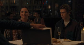 Movie still from “You Hurt My Feelings” (2023), directed by Nicole Holofcener – Two people sitting at a table with a glass of wine; Medium shot, Over the shoulder angle