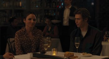 Movie still from “You Hurt My Feelings” (2023), directed by Nicole Holofcener – A man and a woman sitting at a dinner table; Medium shot, Over the shoulder angle