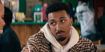 Movie still from “You People” (2023), directed by Kenya Barris – A person wearing a jacket; Close Up shot, Over the shoulder angle