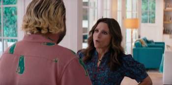 Movie still from “You People” (2023), directed by Kenya Barris – A woman is talking to a man in front of a window; Medium shot, Over the shoulder angle